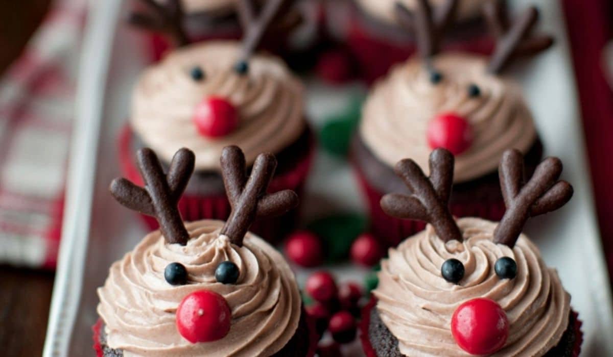 Easy Reindeer Cupcakes on a holiday table with festive decor