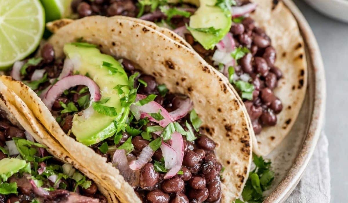 Black Beans served with rice and cilantro in a rustic bowl