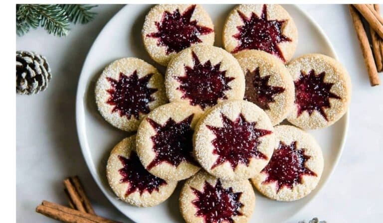 Raspberry Linzer Cookies on rustic holiday table