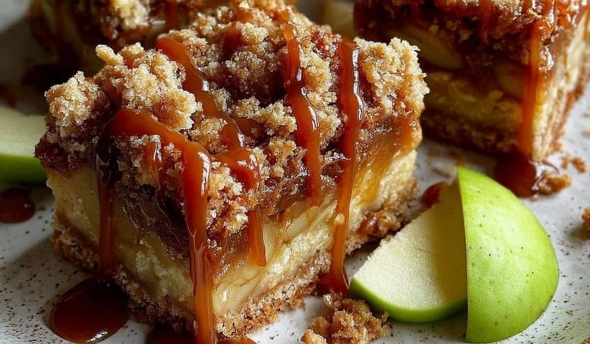 Salted Caramel Apple Crumble Bars freshly baked on rustic table