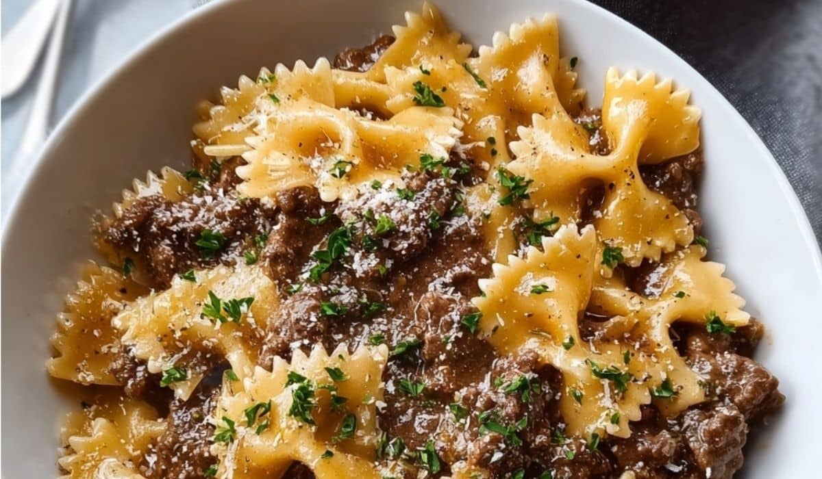Parmesan Garlic Beef Bowtie Pasta in rustic bowl with garnish