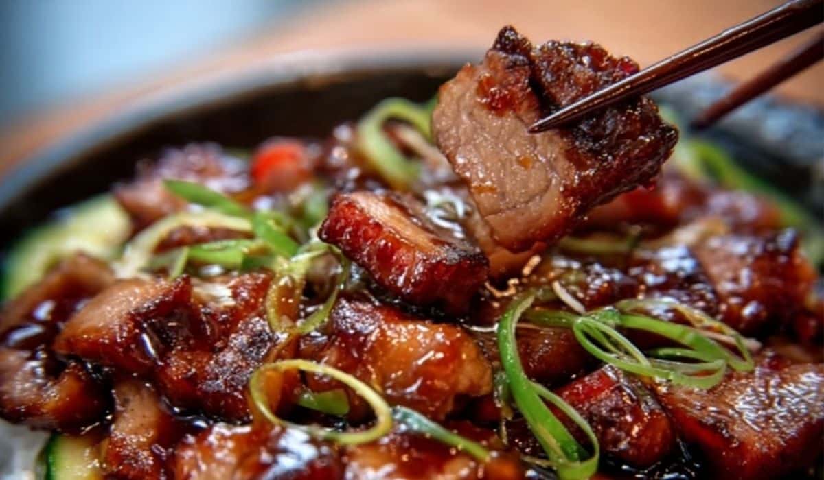 Chinese BBQ pork (char siu) sliced with sticky glaze on a platter