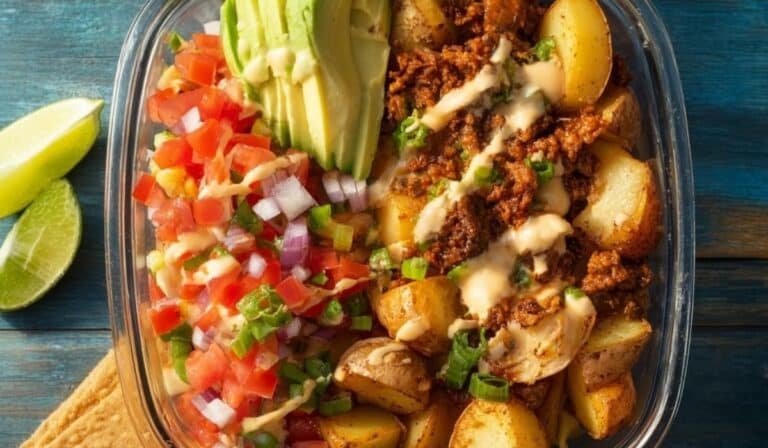 Potato Taco Bowl with crispy potatoes, beans, avocado, and salsa in a rustic bowl